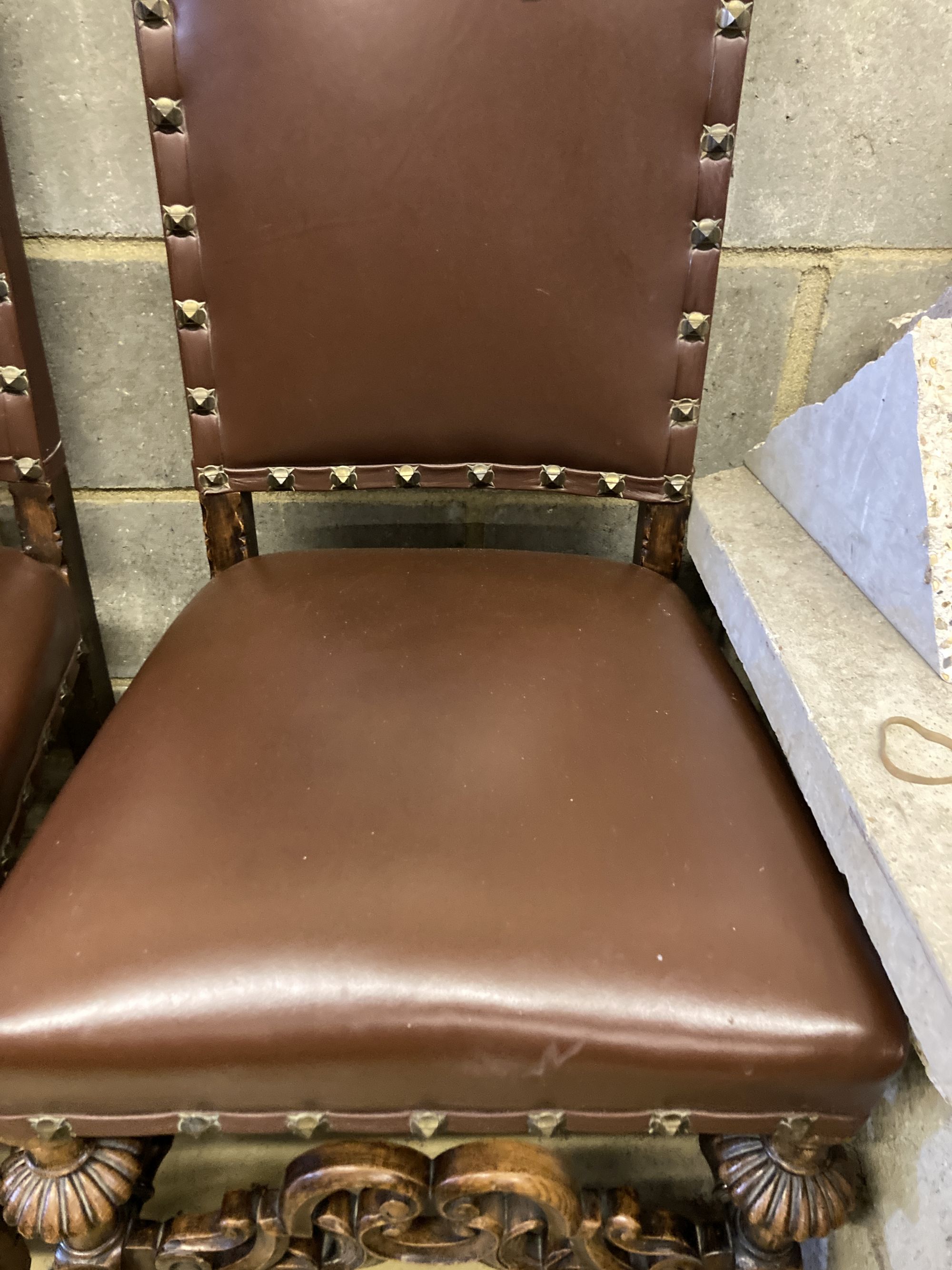 Two early 20th century oak Carolean design dining chairs by Waring & Son